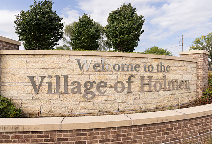Image of Welcome sign to Holmen village